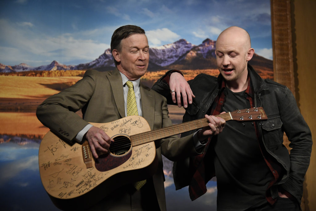 Isaac Slade leans on Governor Hickenlooper as he plays a little tune on his guitar after their PSA shoot. An exclusive on a new Colorado music foundation, an education-focused nonprofit with a powerful board of directors and the backing of Governor Hickenlooper, AEG Live Rocky Mountains and the Anschutz family, that's looking to bring more music to schools amid budget cuts for music and the arts in general. Governor Hickenlooper and Isaac Slade (The Fray) shoot a PSA to announce the foundation March 6, 2017 in Denver, Colorado at the Governors office.